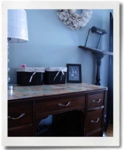 Modge podge a desk, trunk or other furniture for a permanent postcard display.