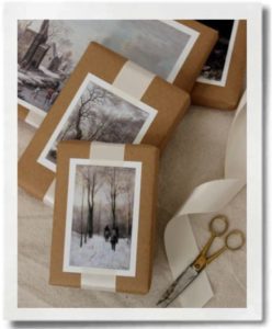 Postcards can turn plain brown paper into elegant gift wrap.