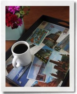 Postcards can be adhered to a tray for a daily reminder of past vacations.