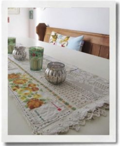 Make a runner out of an assortment of linens and doilies.