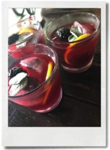 Add a lemon slice and 2 reserved sage leaves and a blackberry on top.